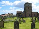 St. Aidan's Church and the castle, Bamburgh, Northumberland