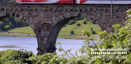 A southbound Virgin train crosses the Royal Border Bridge at Berwick