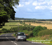 A car on the road to Alnwick